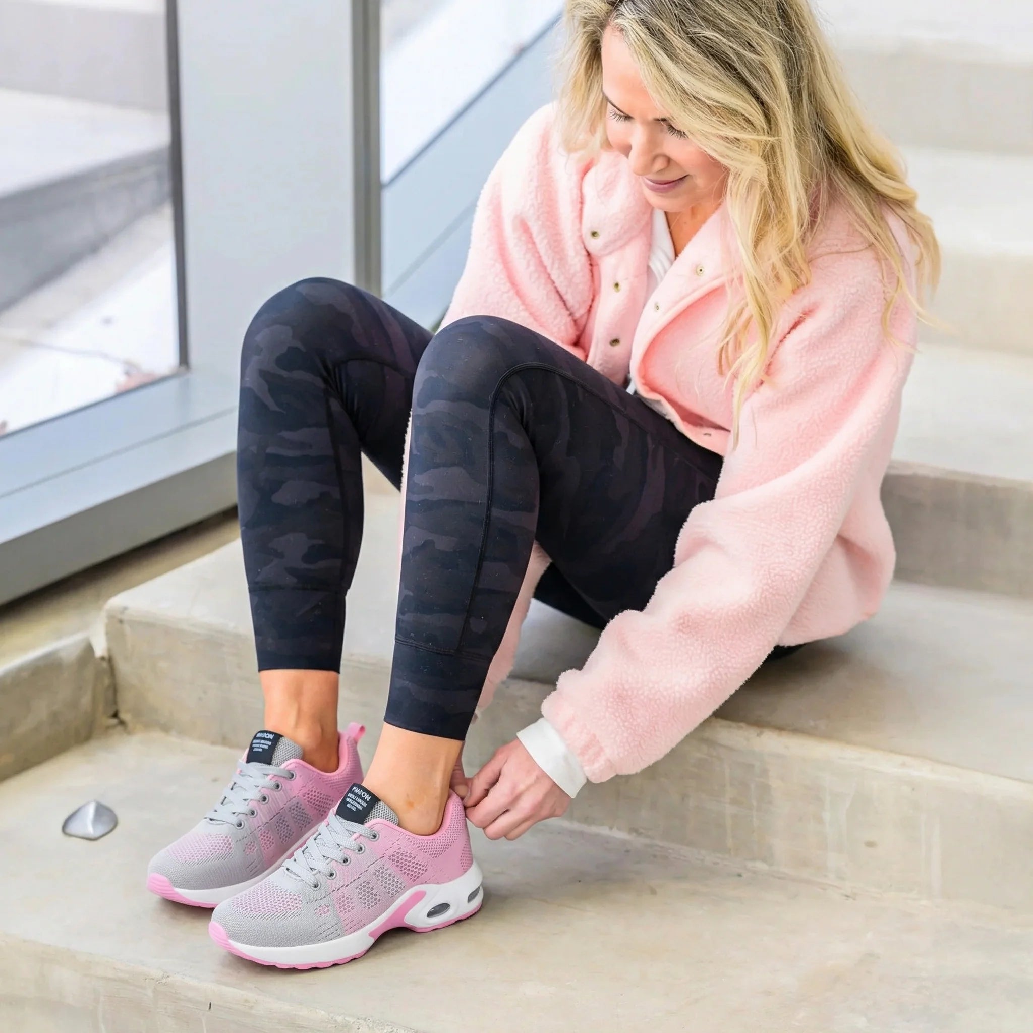 Person putting on Orthora shoes